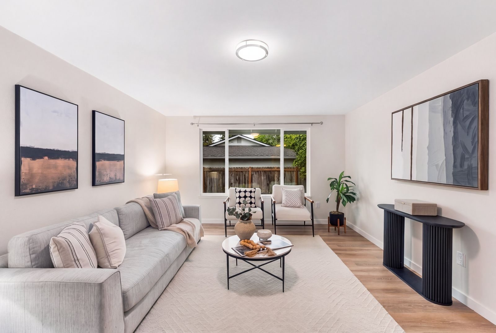Staged living room with neutral furniture and natural light