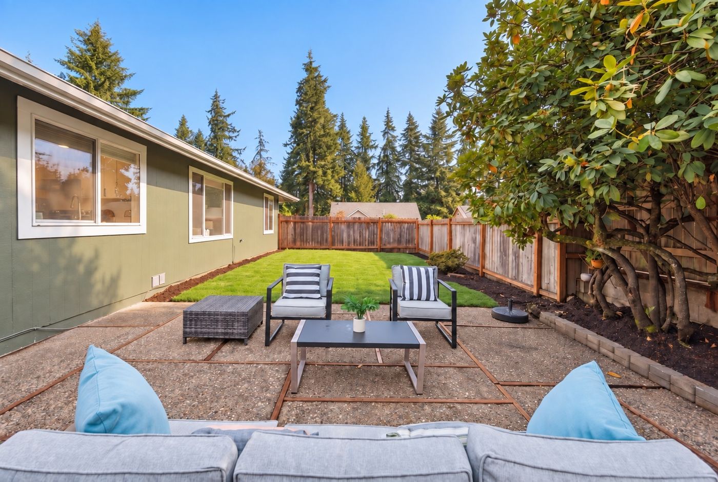Backyard patio and new lawn behind the Redmond home